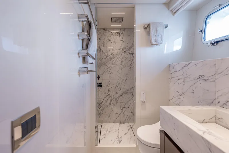 Sofi VI Yacht Photos Pics Luxurious marble bathroom in 2023 Sanlorenzo SL120A yacht, featuring modern fixtures and elegant design.