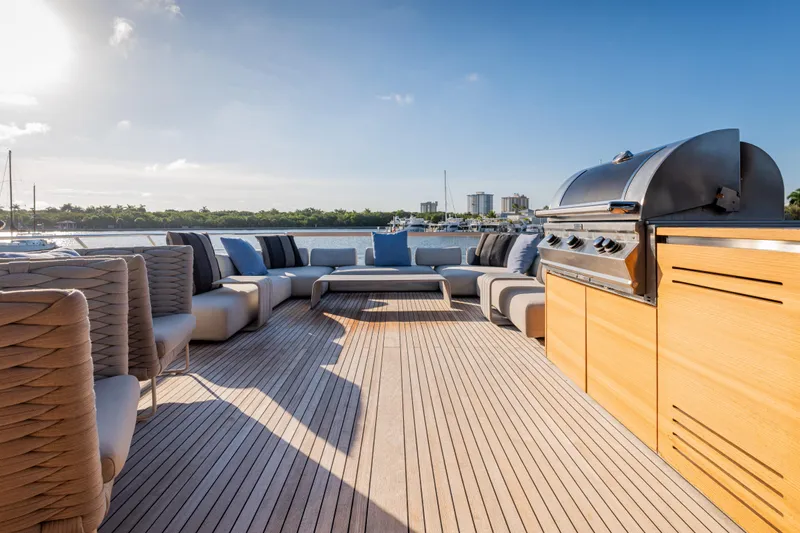 Sofi VI Yacht Photos Pics Luxurious 2023 Sanlorenzo SL120A yacht deck with modern seating and barbecue grill.