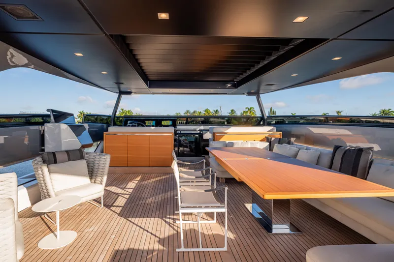 Sofi VI Yacht Photos Pics Luxurious 2023 Sanlorenzo SL120A yacht deck with elegant seating and dining area.