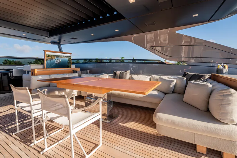 Sofi VI Yacht Photos Pics Luxurious 2023 Sanlorenzo SL120A yacht deck with elegant seating and dining area.