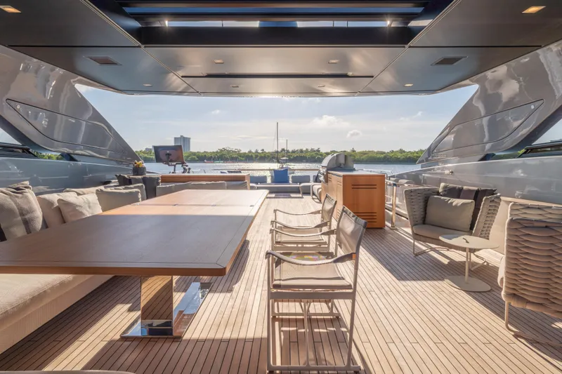 Sofi VI Yacht Photos Pics Luxurious 2023 Sanlorenzo SL120A yacht deck with elegant seating and scenic water view.
