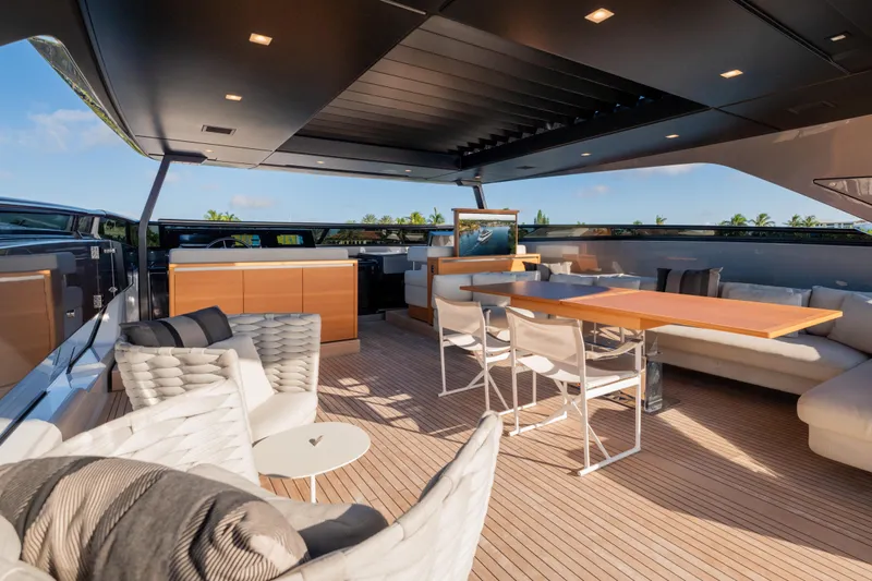 Sofi VI Yacht Photos Pics Luxurious 2023 Sanlorenzo SL120A yacht deck with elegant seating and dining area.