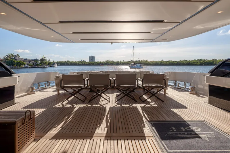 Sofi VI Yacht Photos Pics Luxurious 2023 Sanlorenzo SL120A yacht deck with elegant seating and scenic waterfront view.