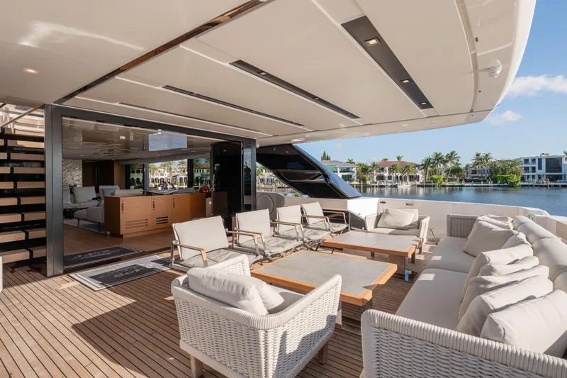 Sofi VI Yacht Photos Pics Luxurious 2023 Sanlorenzo SL120A yacht deck with elegant seating and waterfront view.