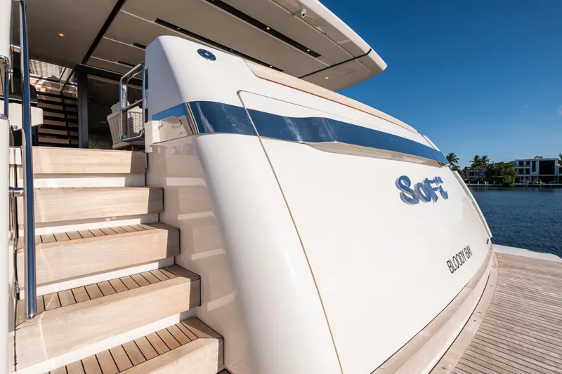 Sofi VI Yacht Photos Pics Luxury Sanlorenzo SL120A yacht, 2023 model, docked with elegant wooden steps and sleek design.