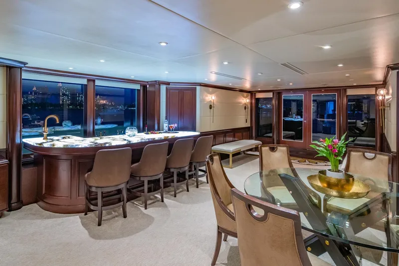 Starship Yacht Photos Pics Luxurious interior of 1986 Van Mill 144 Motor Yacht with elegant dining and bar area.