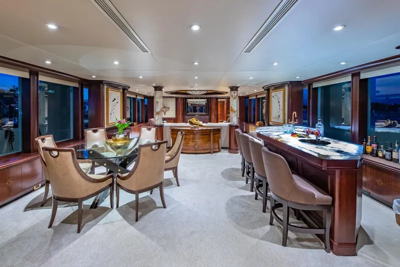 Starship Yacht Photos Pics Luxurious interior of 1986 Van Mill 144 Motor Yacht with elegant dining and bar area.