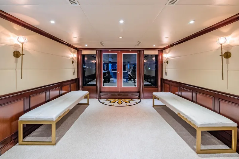 Starship Yacht Photos Pics Luxurious interior of 1986 Van Mill 144 Motor Yacht with elegant benches and lighting.