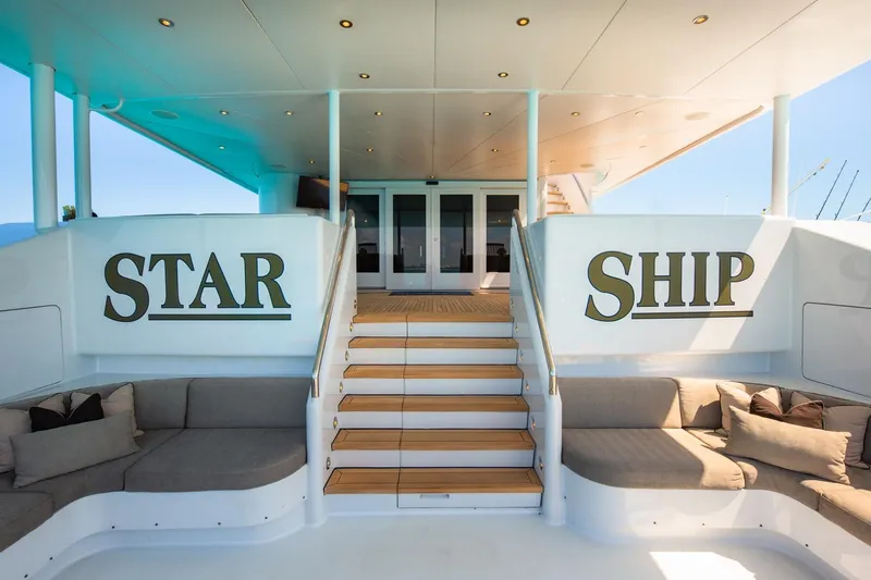 Starship Yacht Photos Pics Luxurious 1986 Van Mill 144 Motor Yacht with elegant seating and "Star Ship" signage.