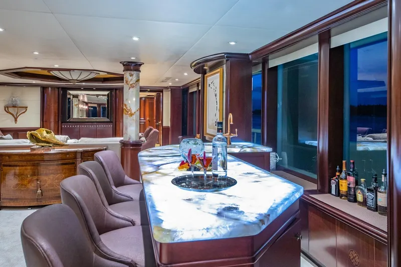 Starship Yacht Photos Pics Luxurious interior of 1986 Van Mill 144 Motor Yacht with elegant bar and seating area.