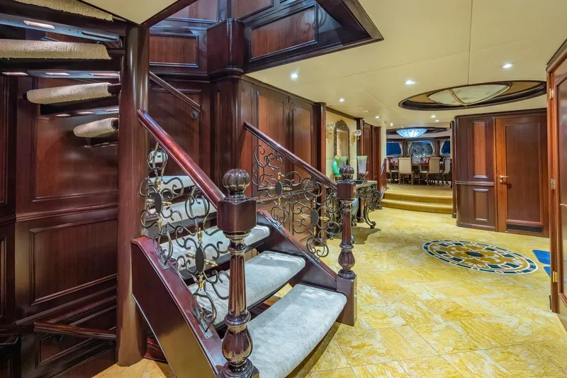 Starship Yacht Photos Pics Luxurious interior of 1986 Van Mill 144 Motor Yacht with elegant staircase and dining area.