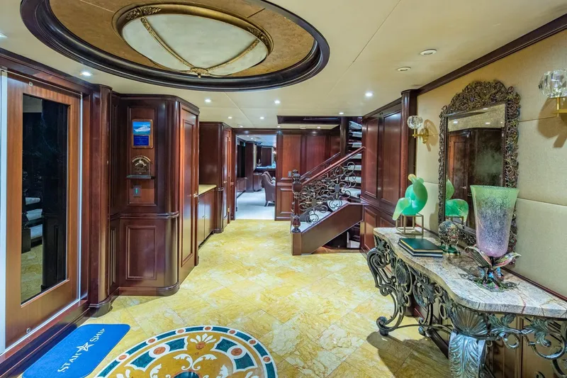 Starship Yacht Photos Pics Luxurious interior of 1986 Van Mill 144 Motor Yacht with elegant wood paneling and ornate decor.