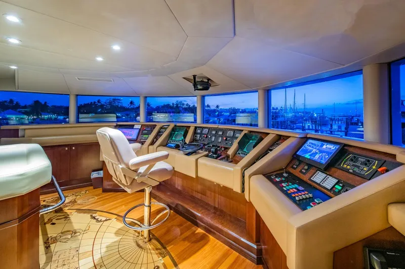 Starship Yacht Photos Pics Luxurious helm of 1986 Van Mill 144 Motor Yacht with panoramic views and advanced controls.