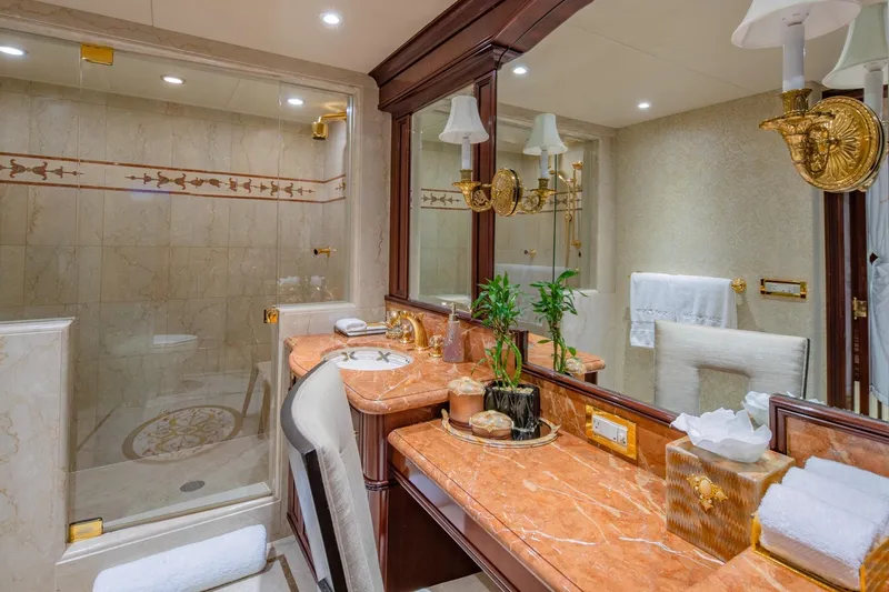 Starship Yacht Photos Pics Luxurious bathroom on 1986 Van Mill 144 Motor Yacht with marble countertops and elegant decor.