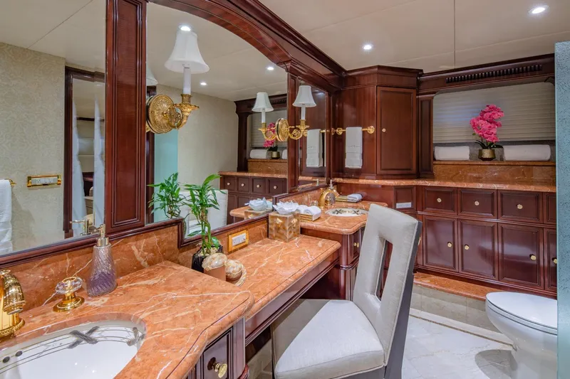 Starship Yacht Photos Pics Luxurious bathroom on 1986 Van Mill 144 Motor Yacht with elegant wood and marble finishes.