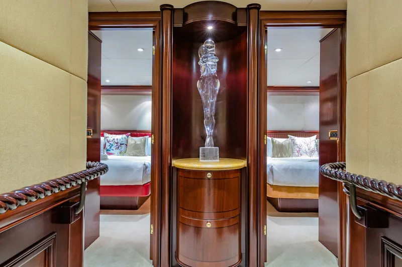 Starship Yacht Photos Pics Luxurious interior of 1986 Van Mill 144 Motor Yacht with elegant wood finishes and sculpture.