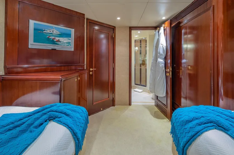 Starship Yacht Photos Pics Luxurious cabin interior of 1986 Van Mill 144 Motor Yacht with elegant wood finishes.