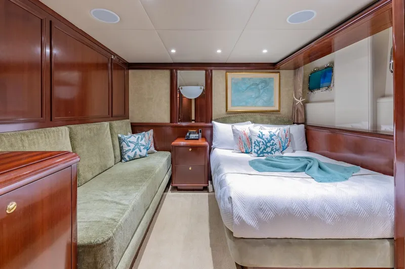Starship Yacht Photos Pics Luxurious cabin interior of 1986 Van Mill 144 Motor Yacht with elegant wood paneling.