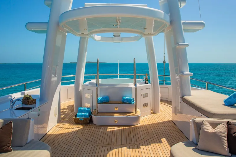 Starship Yacht Photos Pics Luxurious deck of 1986 Van Mill 144 Motor Yacht with ocean view.