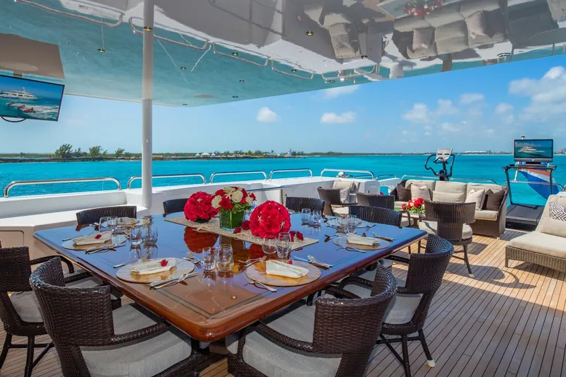 Starship Yacht Photos Pics Luxurious dining area on 1986 Van Mill 144 Motor Yacht with ocean view.