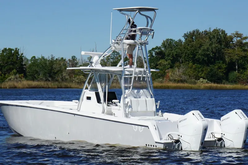  Yacht Photos Pics Custom HHH 35LX Catamaran 2020 on water, featuring dual Mercury outboard engines.