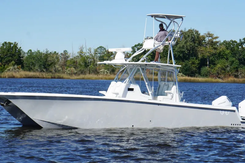  Yacht Photos Pics Custom HHH 35LX Catamaran 2020 on calm water, featuring sleek design and dual outboard engines.