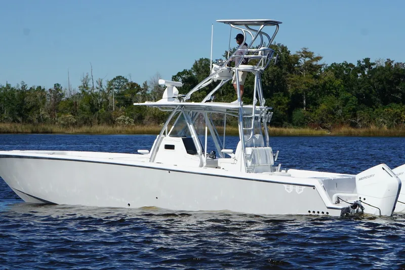  Yacht Photos Pics Custom HHH 35LX Catamaran 2020 on water, featuring elevated helm and twin Mercury engines.