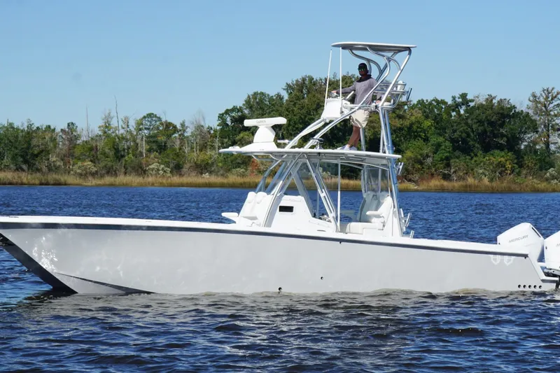  Yacht Photos Pics Custom HHH 35LX Catamaran 2020 on water, featuring elevated helm and twin engines.