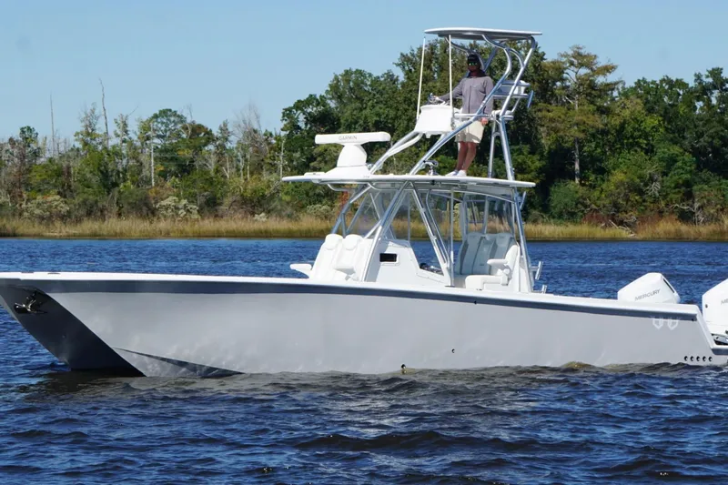  Yacht Photos Pics Custom HHH 35LX Catamaran 2020 on water, featuring sleek design and dual outboard engines.