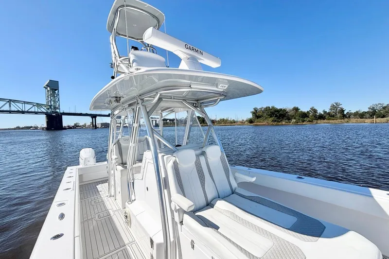  Yacht Photos Pics Custom HHH 35LX Catamaran 2020 on water, bridge in background, clear sky.