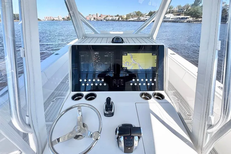  Yacht Photos Pics Cockpit view of 2020 Custom HHH 35LX Catamaran with navigation display and steering wheel.