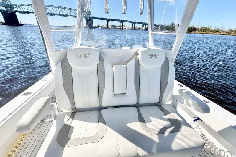  Yacht Photos Pics Luxurious seating on a 2020 Custom HHH 35LX Catamaran with scenic water and bridge view.
