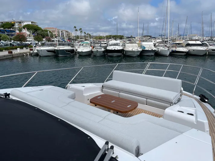 Melita Yacht Photos Pics Azimut 60 Flybridge 2023 yacht docked in marina, featuring spacious seating area.