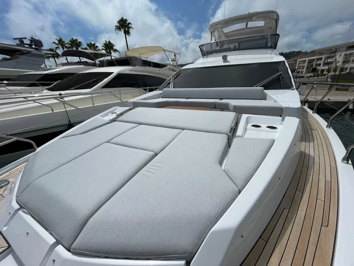 Melita Yacht Photos Pics Azimut 60 Flybridge 2023 yacht with spacious sunbathing area, docked at marina.