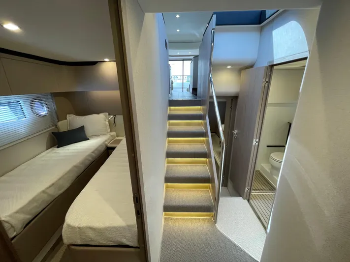 Melita Yacht Photos Pics Interior of Azimut 60 Flybridge 2023 yacht, featuring a modern cabin and staircase.