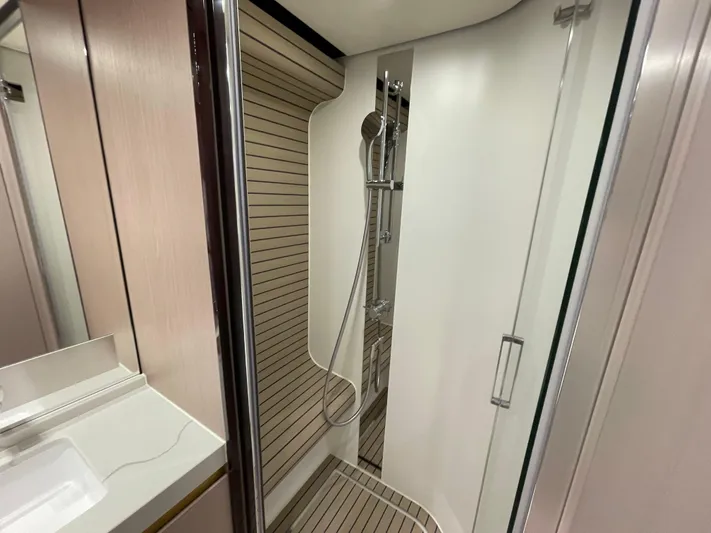 Melita Yacht Photos Pics Luxurious shower in 2023 Azimut 60 Flybridge yacht, featuring modern design and sleek fixtures.