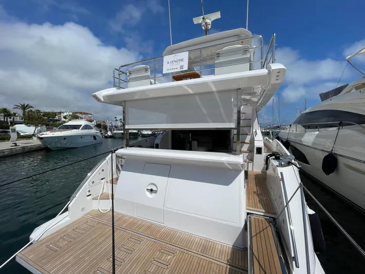 Melita Yacht Photos Pics Azimut 60 Flybridge 2023 yacht docked at marina, showcasing sleek design and spacious deck.