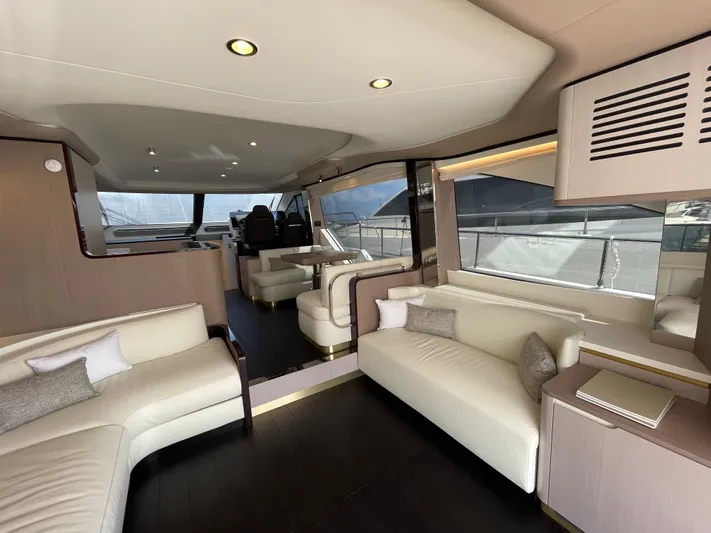 Melita Yacht Photos Pics Luxurious interior of 2023 Azimut 60 Flybridge yacht with elegant seating and modern design.