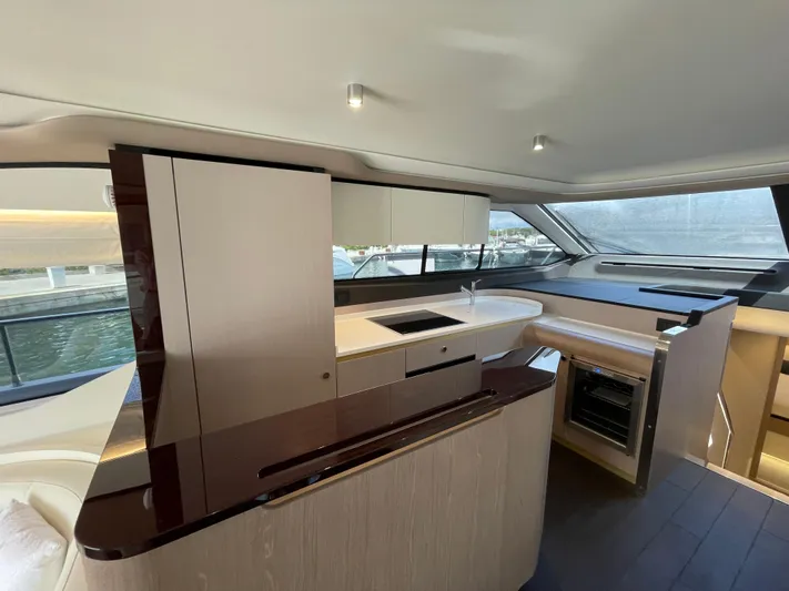 Melita Yacht Photos Pics Luxurious interior of 2023 Azimut 60 Flybridge yacht with modern kitchen design.