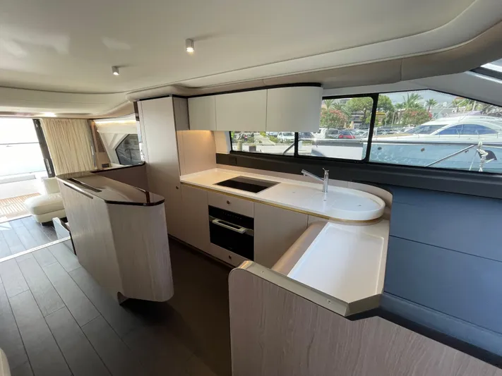 Melita Yacht Photos Pics Luxurious interior of 2023 Azimut 60 Flybridge yacht, featuring modern kitchen design.