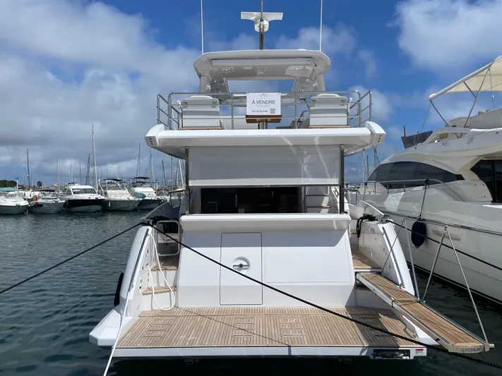 Melita Yacht Photos Pics Azimut 60 Flybridge 2023 yacht docked at marina, rear view.