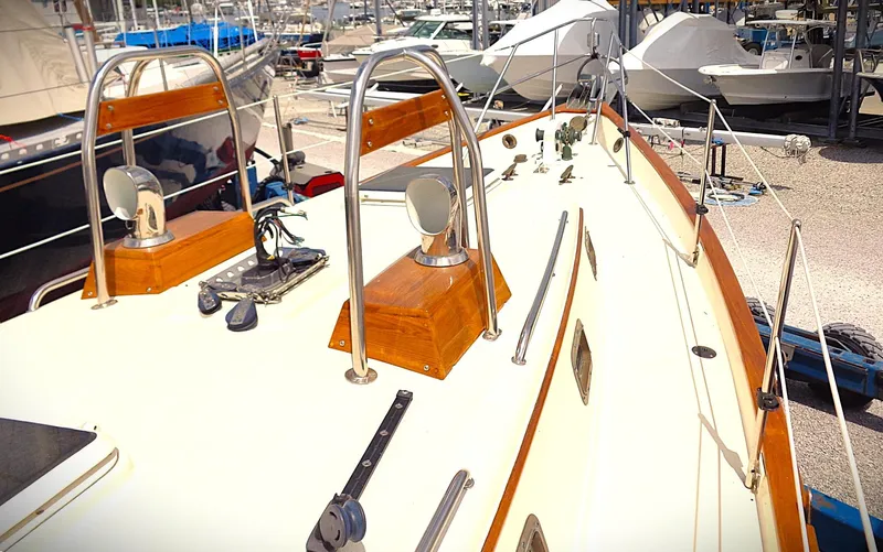 Scout Yacht Photos Pics 1998 Pacific Seacraft 34 sailboat deck with wooden accents and metal fixtures.