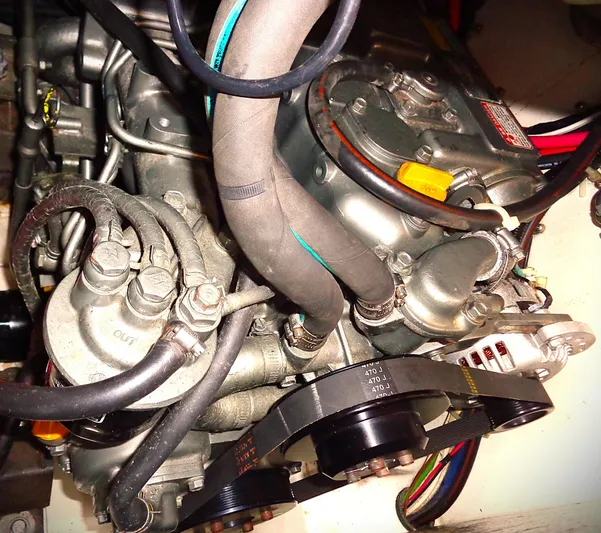 Scout Yacht Photos Pics Engine compartment of a 1998 Pacific Seacraft 34 sailboat, showing hoses and belts.