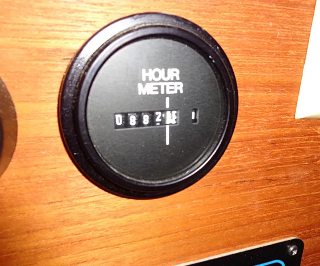 Scout Yacht Photos Pics Hour meter on 1998 Pacific Seacraft 34, displaying 8821 hours, mounted on wooden panel.