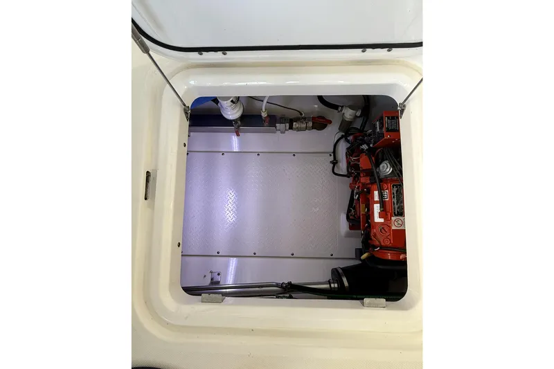 Ghost Yacht Photos Pics Engine compartment of a 2012 Everglades 350LX boat, showcasing mechanical components.