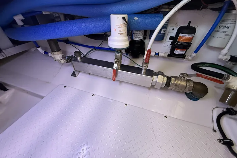 Ghost Yacht Photos Pics Engine room of 2012 Everglades 350LX boat with plumbing and filtration system.