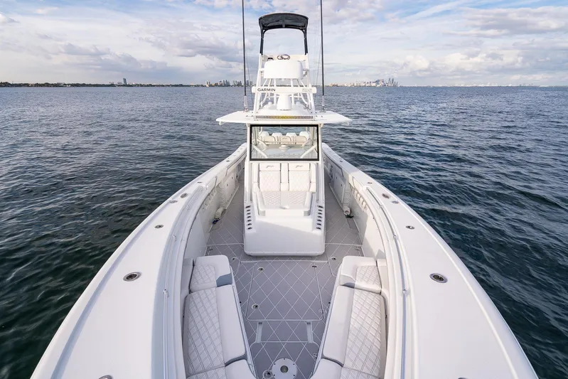  Yacht Photos Pics 2022 Yellowfin 42 boat on open water with spacious deck and seating.