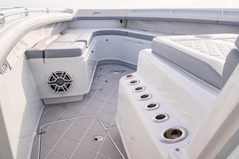  Yacht Photos Pics 2022 Yellowfin 42 boat interior with cushioned seating and rod holders.