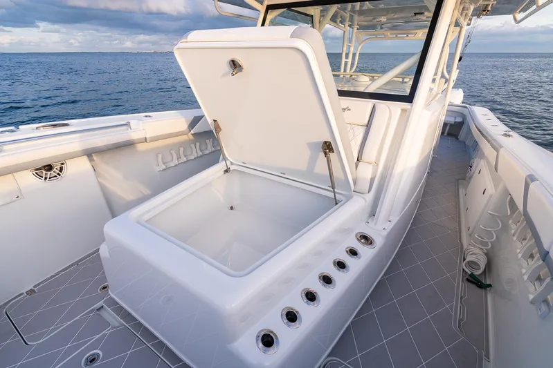  Yacht Photos Pics 2022 Yellowfin 42 boat with open storage compartment on deck.