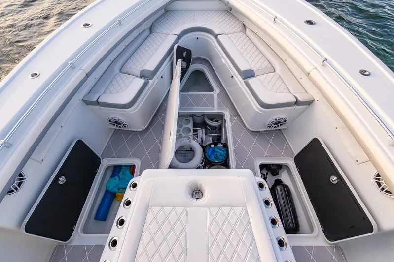  Yacht Photos Pics 2022 Yellowfin 42 boat interior with storage compartments and cushioned seating.